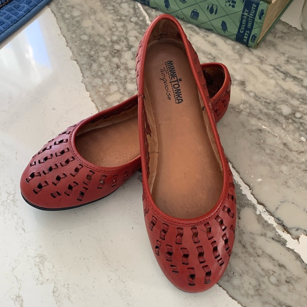 Minnetonka flats, red perforated leather upper.